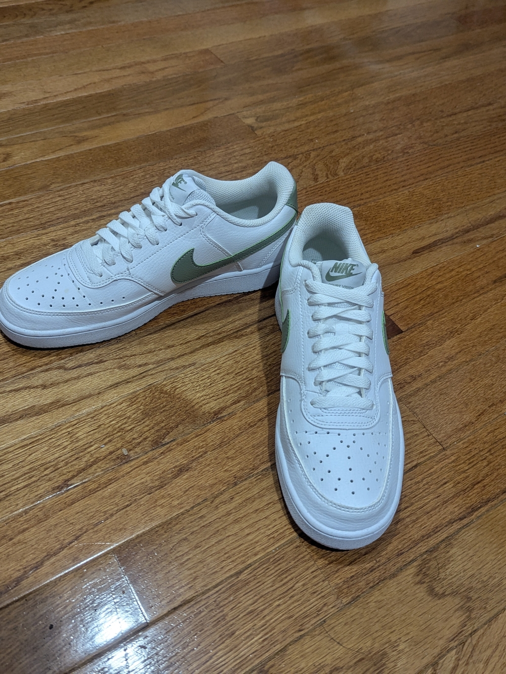Nike Men’s White Sneakers with Green Swoosh Accent